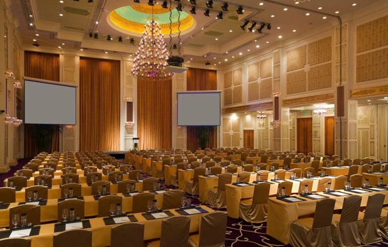 large event space with seating for people to watch a speaker